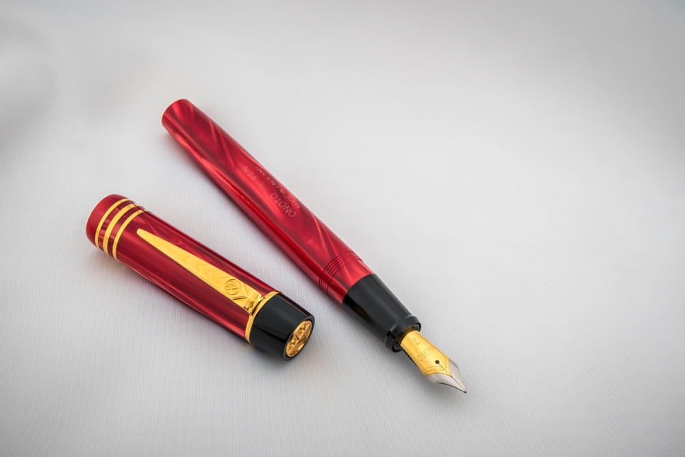 Magna Classic Burgundy Pearl & Gold Fittings